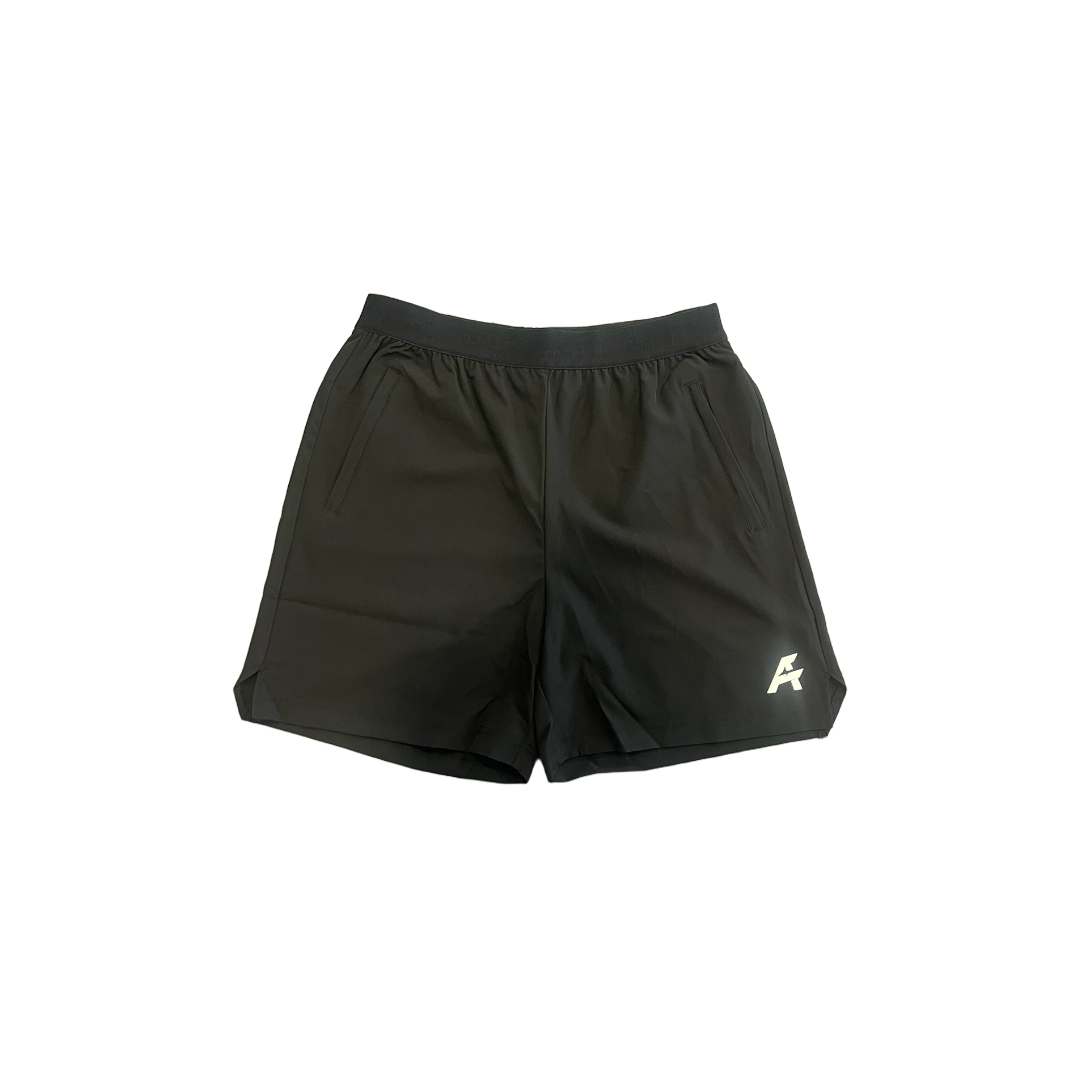 Black athletic shorts with a logo on a white background